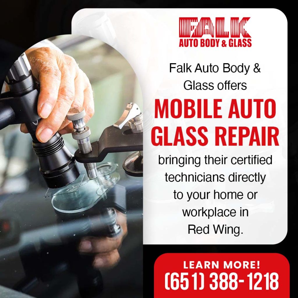technician performing mobile auto glass repair using windshield chip repair tool at customer location in Red Wing